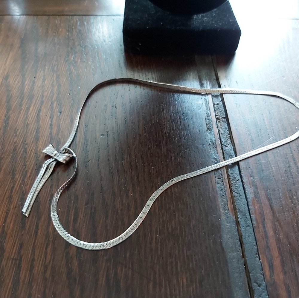 SILVER BOW NECKLACE